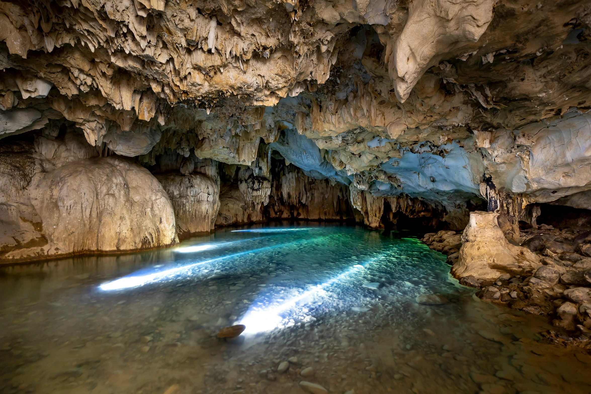 a view of a pool in a cave