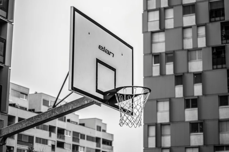 an image of a basketball hoop on the city street