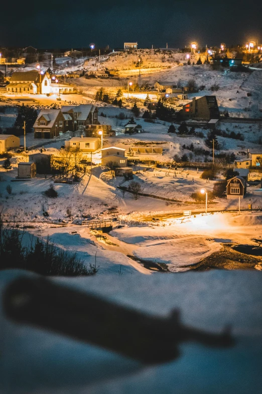 an aerial view of the lights of towns at night