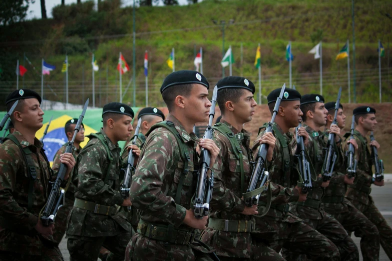 soldiers with rifles marching in a group