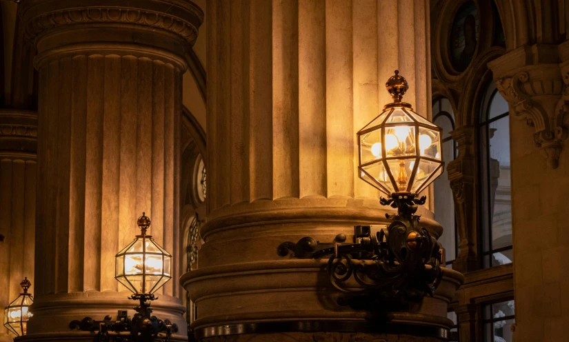 some large columns and lights inside a building