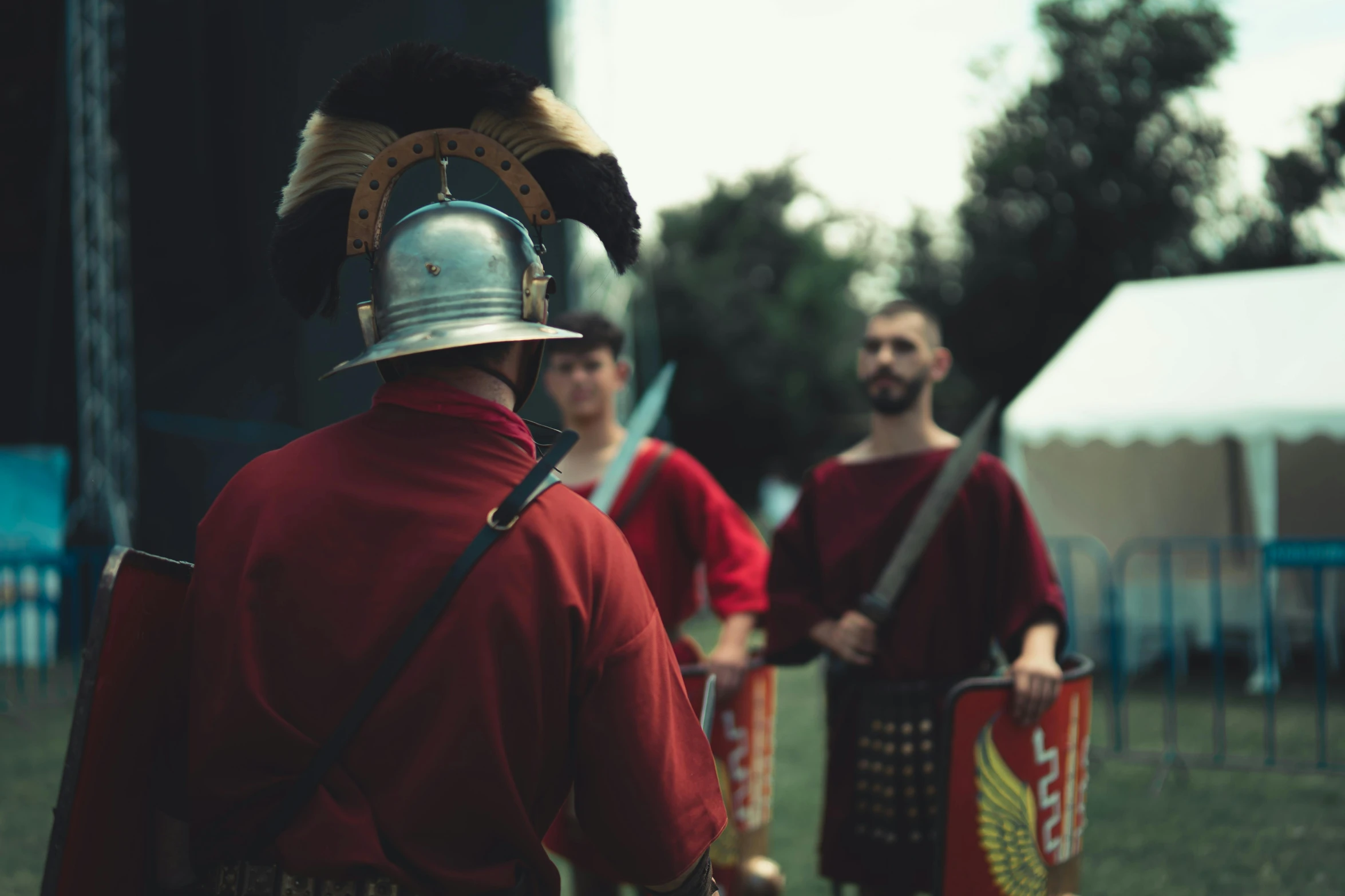 several men wearing helmets and shields at an event