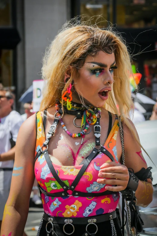 the woman is wearing a multi colored top and some headgear