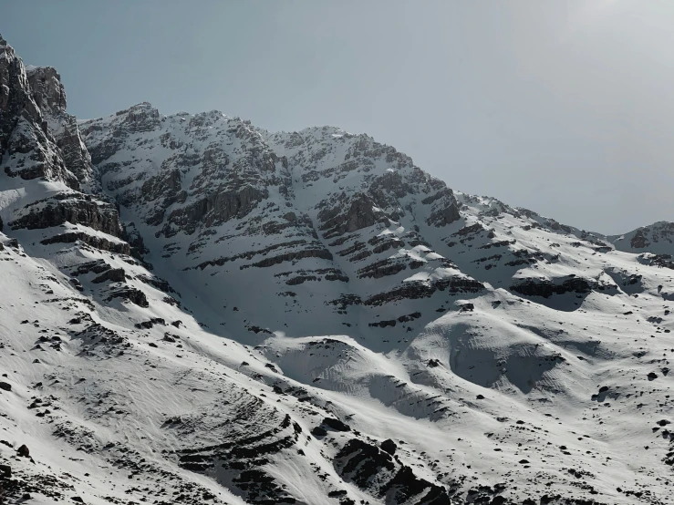 a lone person snow boarding on a mountain