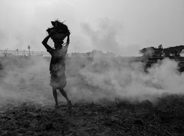 man with beard in the smoke with dark sky background