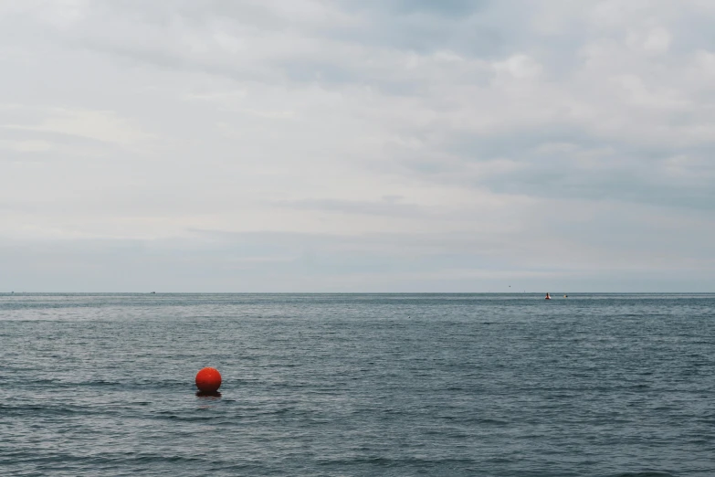 a person swimming in the middle of the ocean