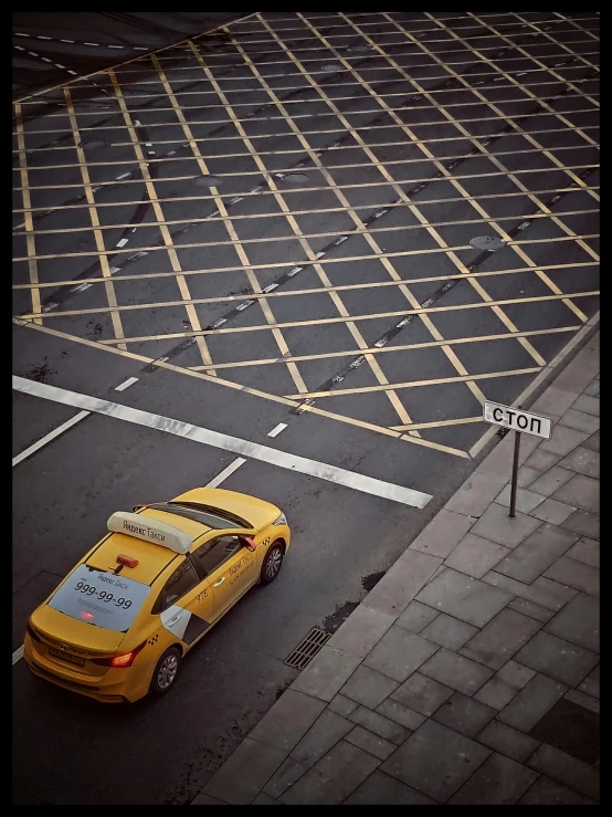 a taxi cab that is parked at an intersection