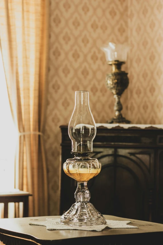 a glass sitting on top of a table