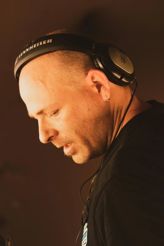 a man with headphones on with a microphone