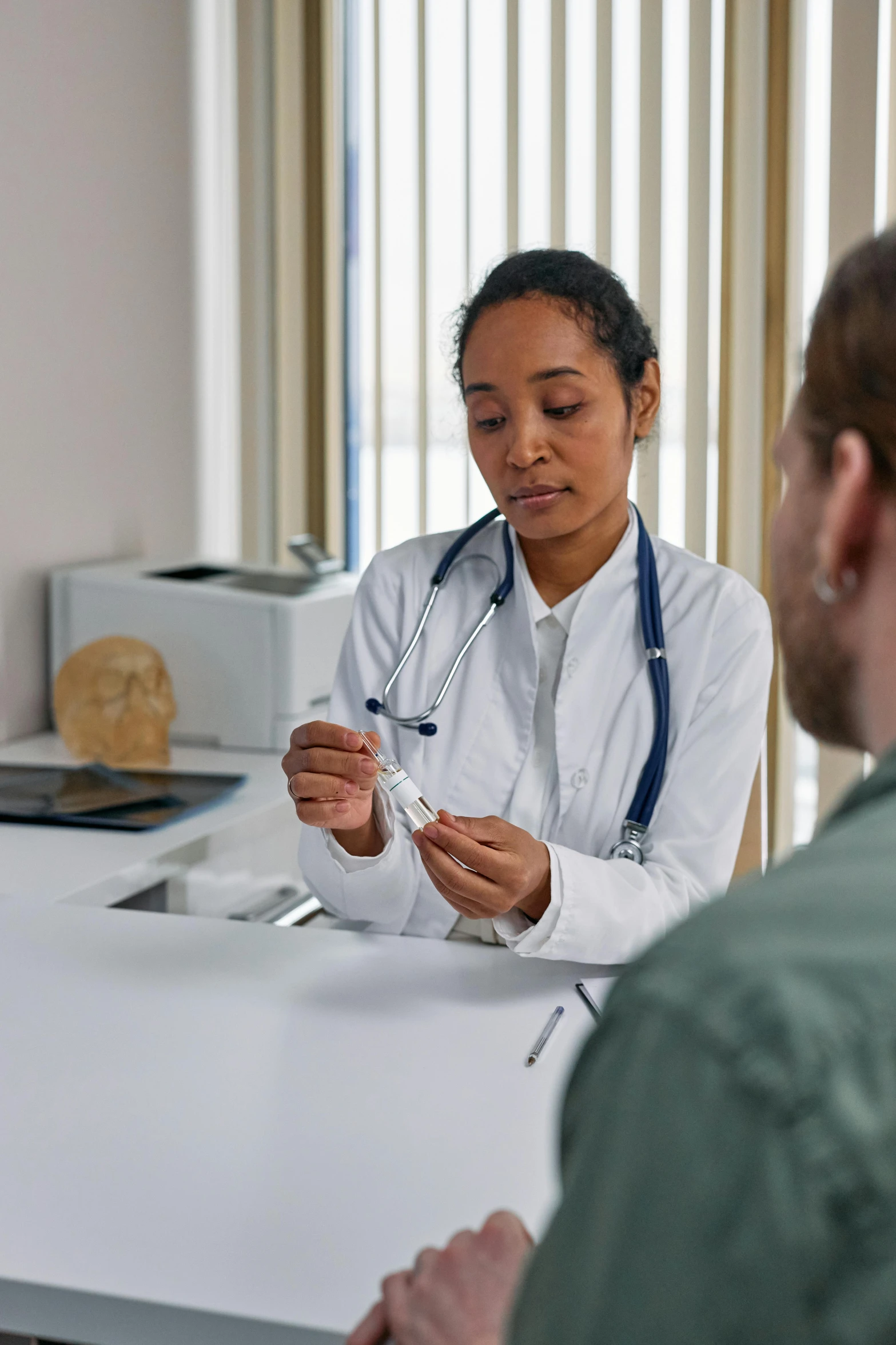 woman doctor working on small patient in medical setting