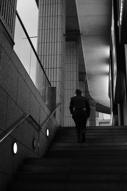 a man that is walking up some stairs