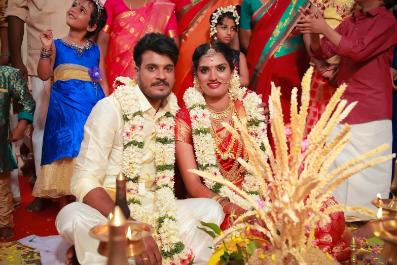 a man and a woman pose in their wedding attire