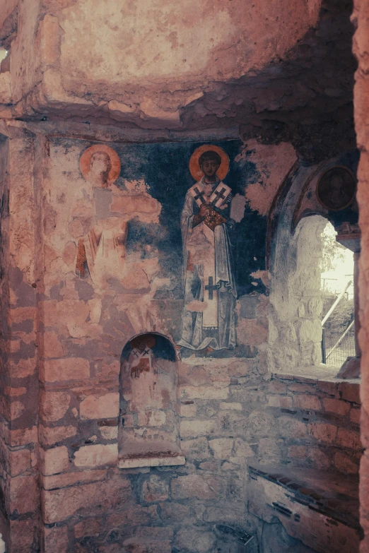 painting of an angel next to the cross