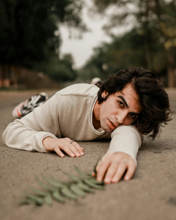 an image of a man that is laying down on the ground