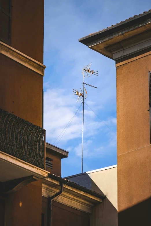 the top of an antenna on the building