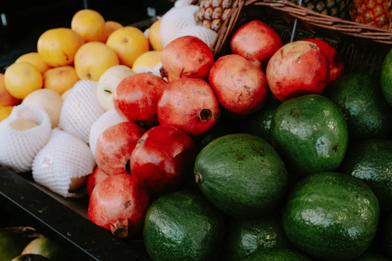 a number of fruits piled on top of each other