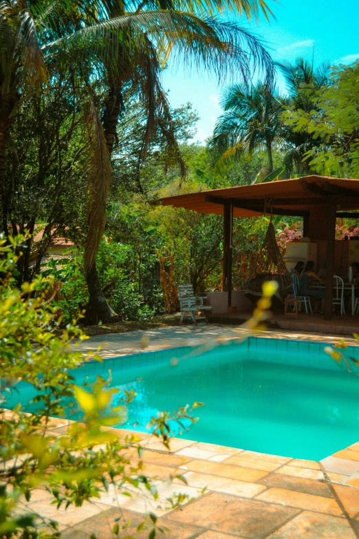 there is a small pool in the yard of a home