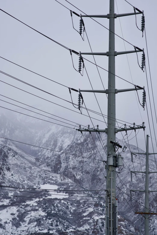 some very pretty power lines that are by the mountains