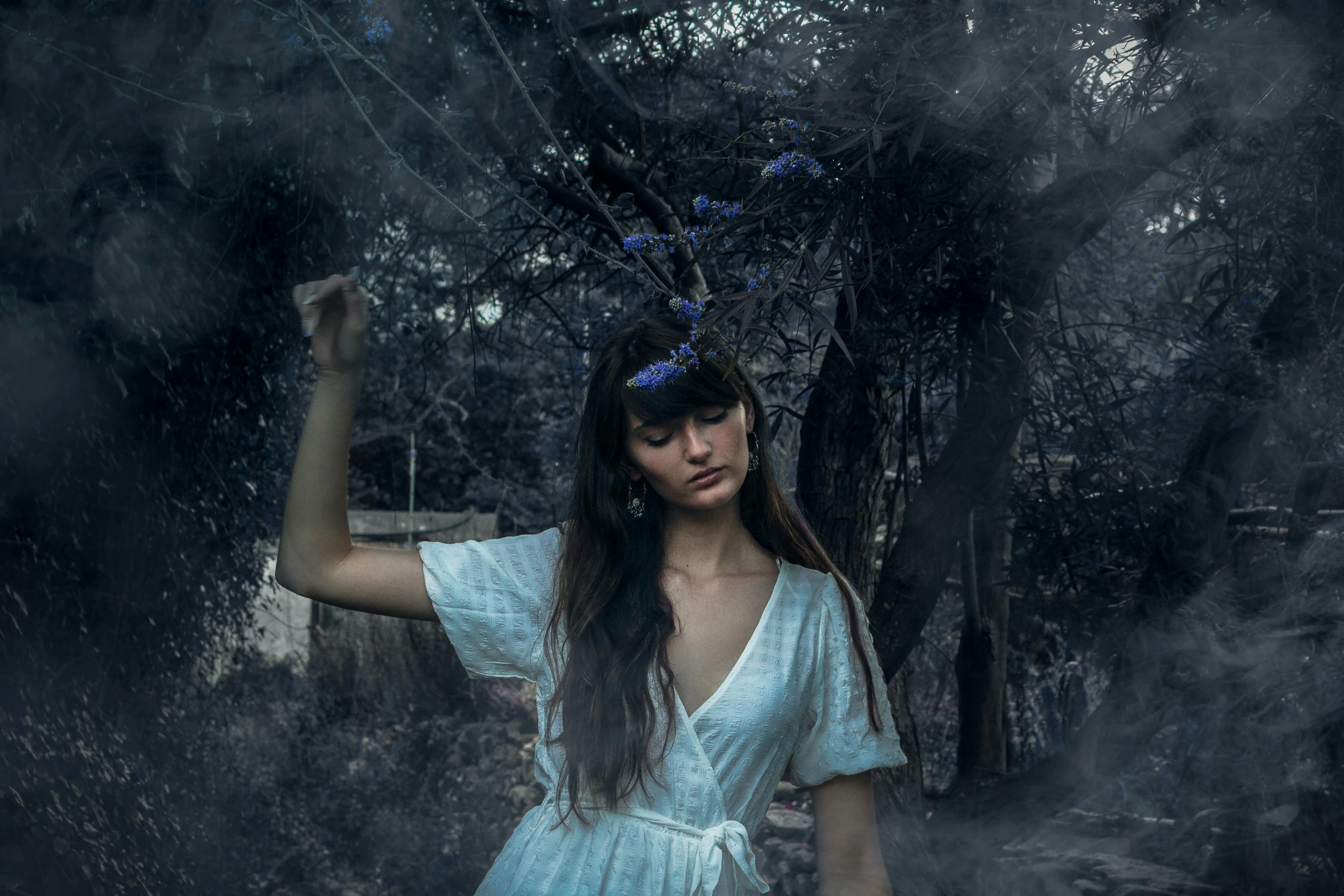 an image of a woman posing in the woods