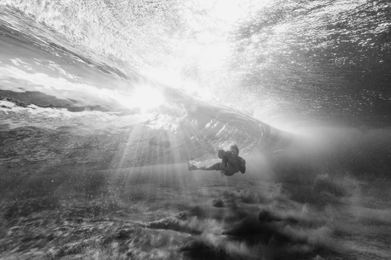 sun shines through the water creating a unique pattern over the ocean floor