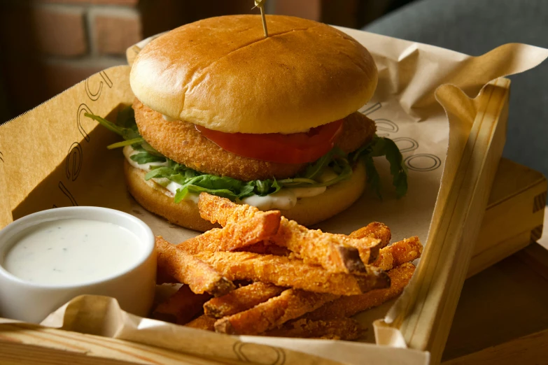 a chicken sandwich and chips are in a basket