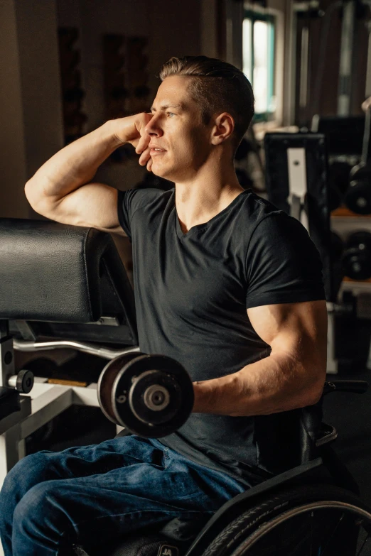 a man that is sitting down in a chair