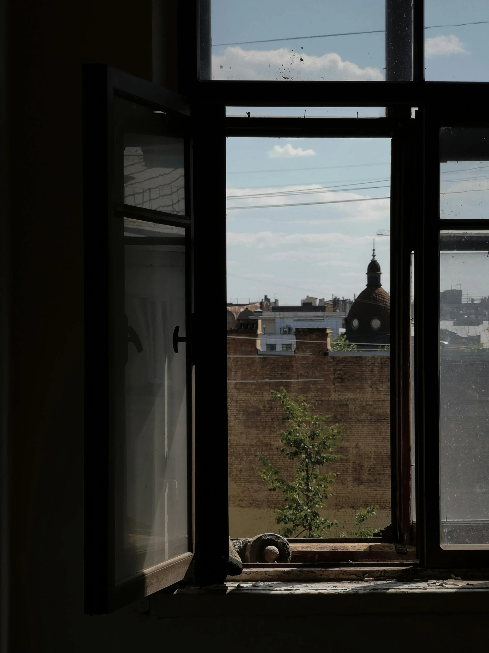 a view from the window of a building looking out onto a city