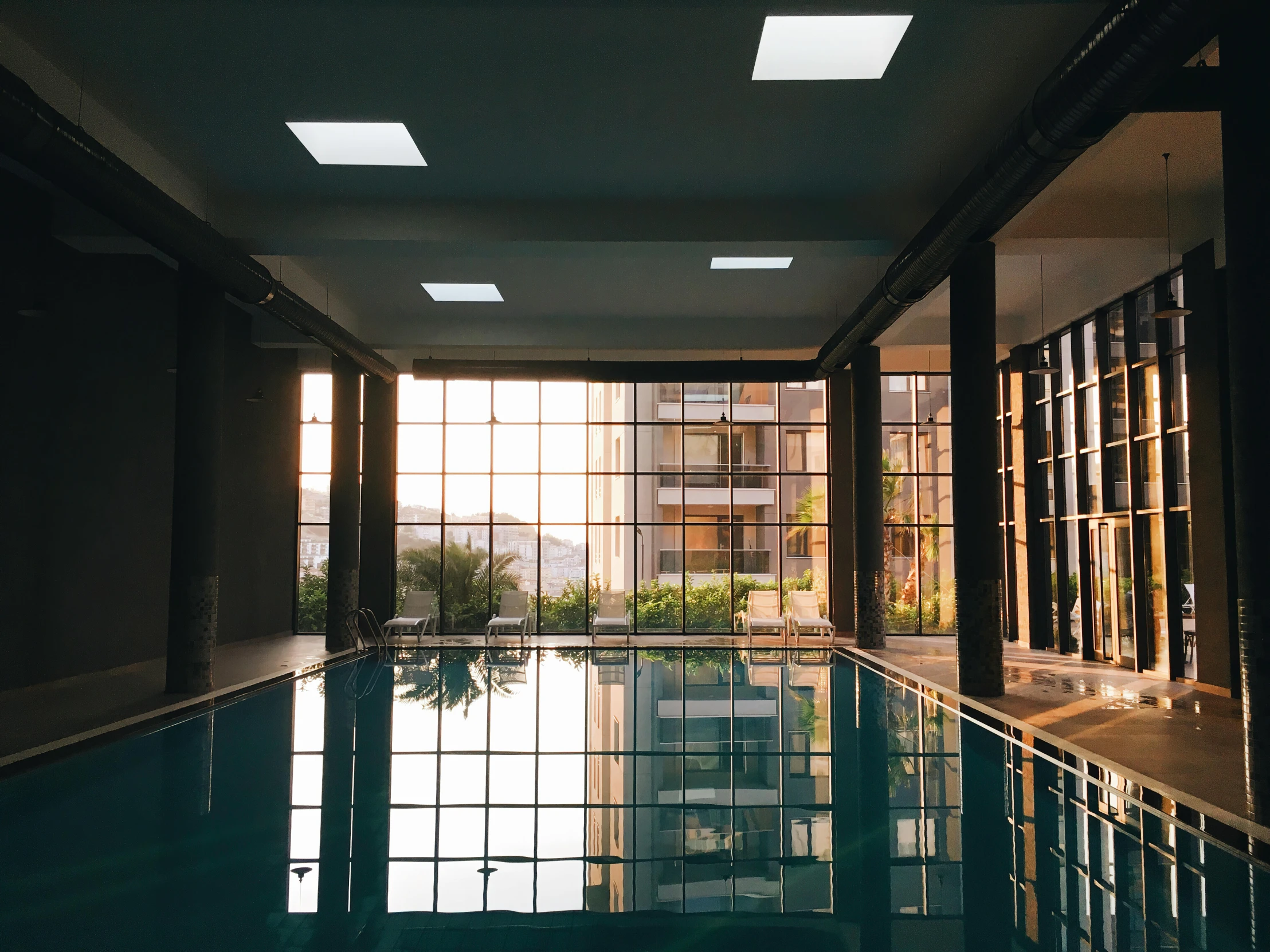 large open indoor swimming pool near building