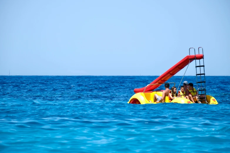 three people are riding on an inflatable raft boat