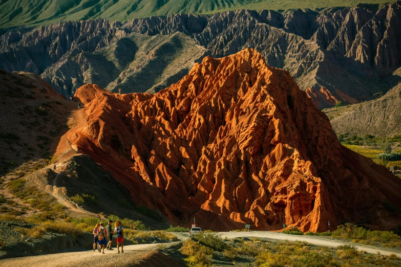 some people are riding on horseback in the mountains