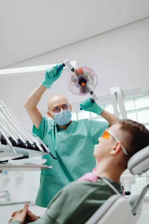 a dentist at the dentist office doing an operation