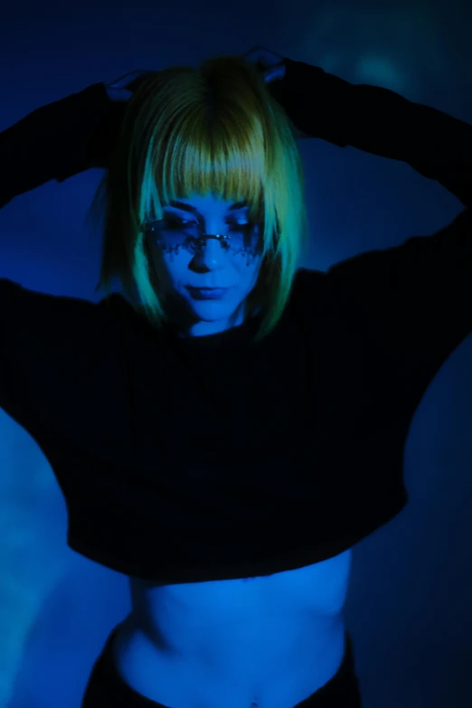 a woman with a neon blue light on her face