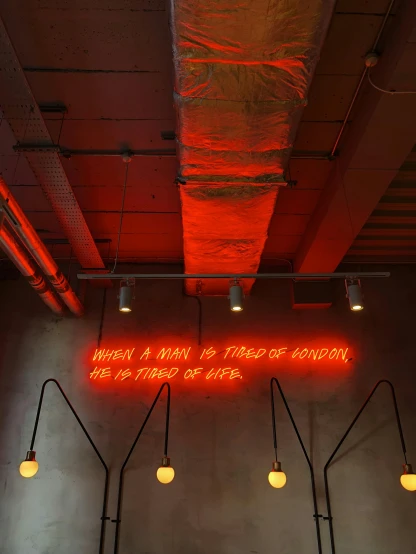 a room with a large neon sign above it