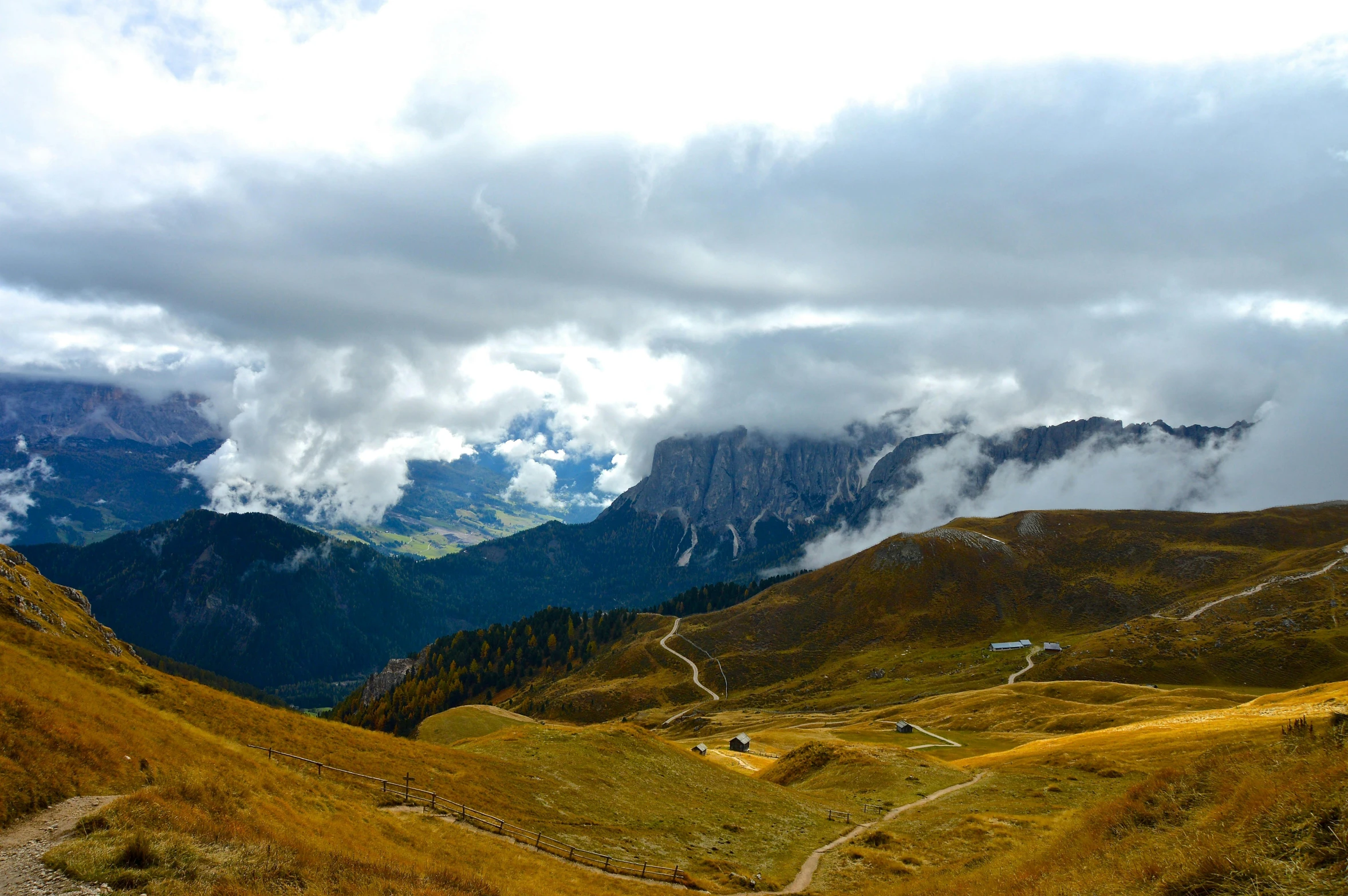 a very scenic view from a distance with mountains in the background