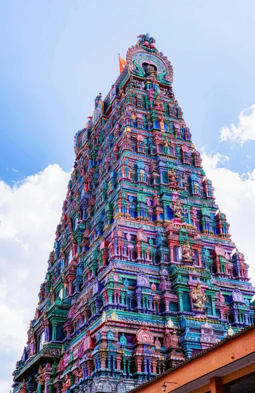 an elaborate and colorfully decorated tower of a hindu temple