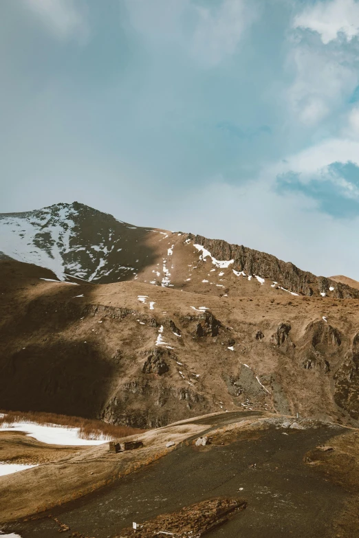 a beautiful mountain is shown with snow on it