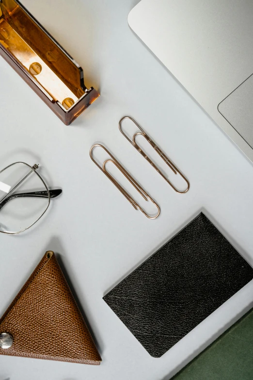 the supplies needed to attach eyeglasses and glasses are laying out on the desk