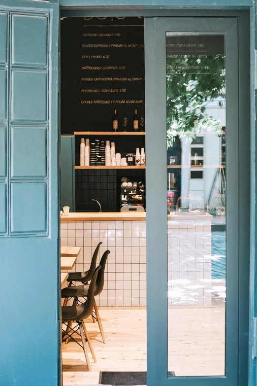 the view of an outside cafe from the entrance