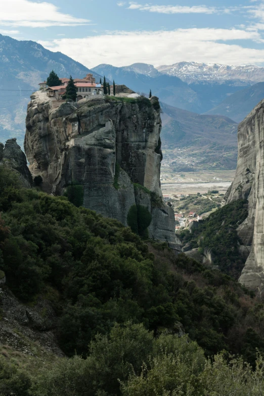 a scenic view of a town sitting on top of a hill