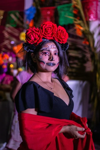 a woman with face paint is posing for a po