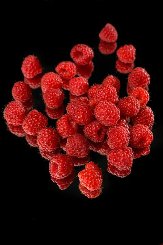 some raspberries are laying out on a table