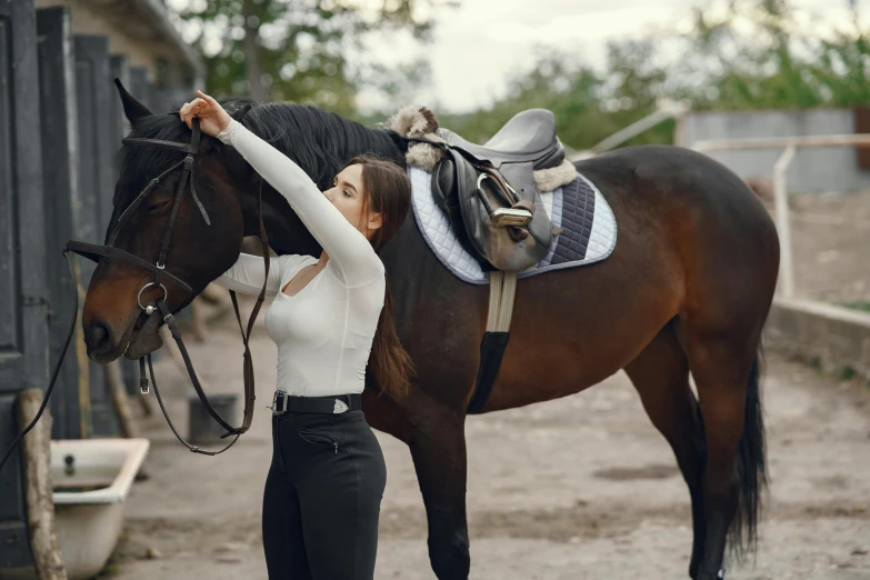 a woman and horse are posing with the horse