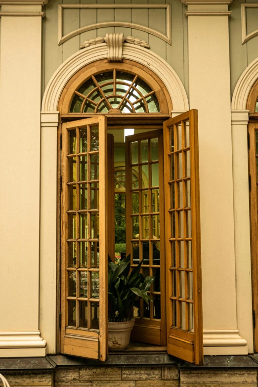 a wood door opens in to a white building