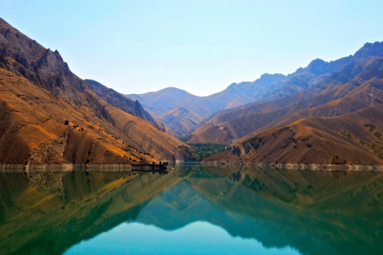 a body of water surrounded by mountains and water