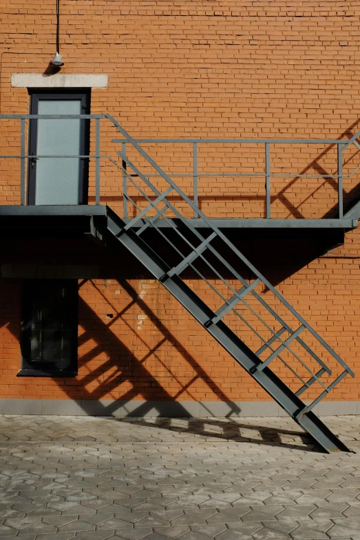 a building with an open roof and a metal fire escape