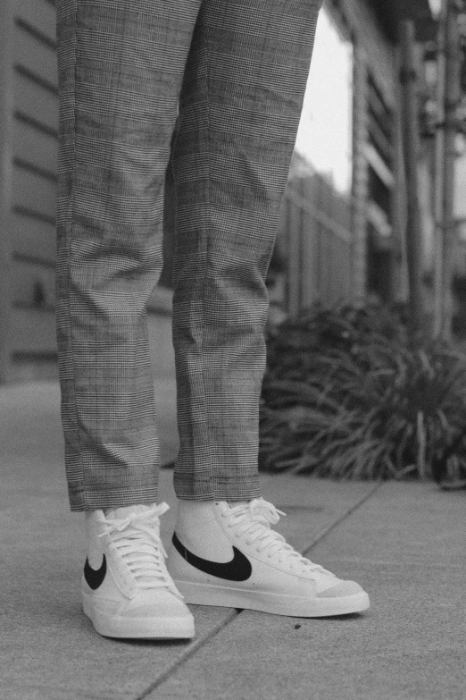 black and white pograph of someone's foot and shoes