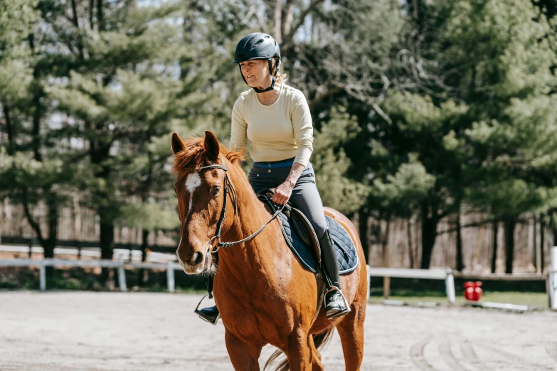 a person is riding a horse on the course