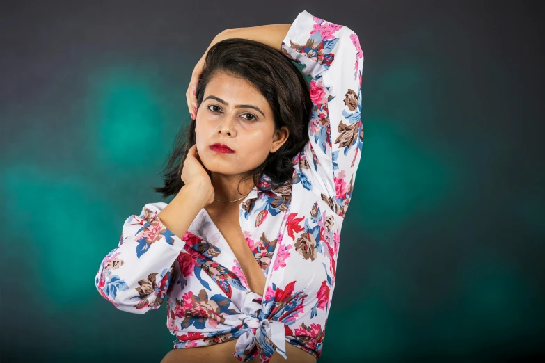 a very attractive woman in a flowered top