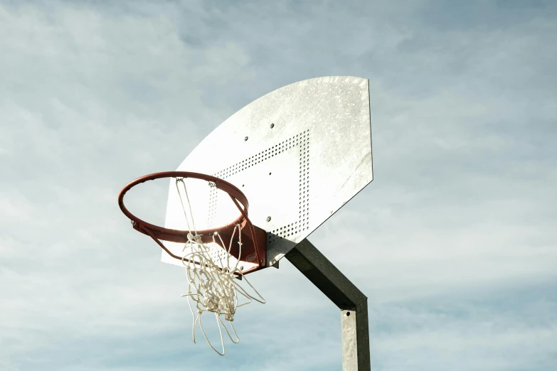 a basketball is in the air above the rim