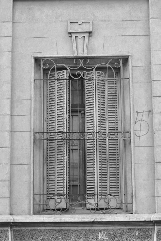 a couple of windows with silver metal bars